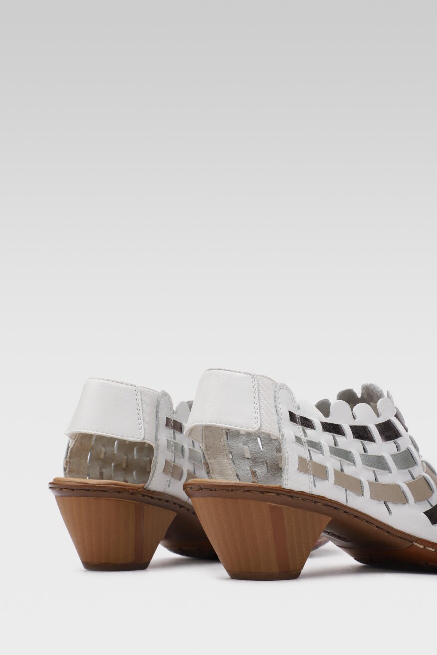 
                Rieker - Skórzane sandały na obcasie - 5903698626796